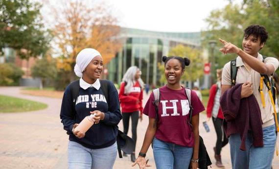 First Year Hamline Students are talking with each other at Hamline University.