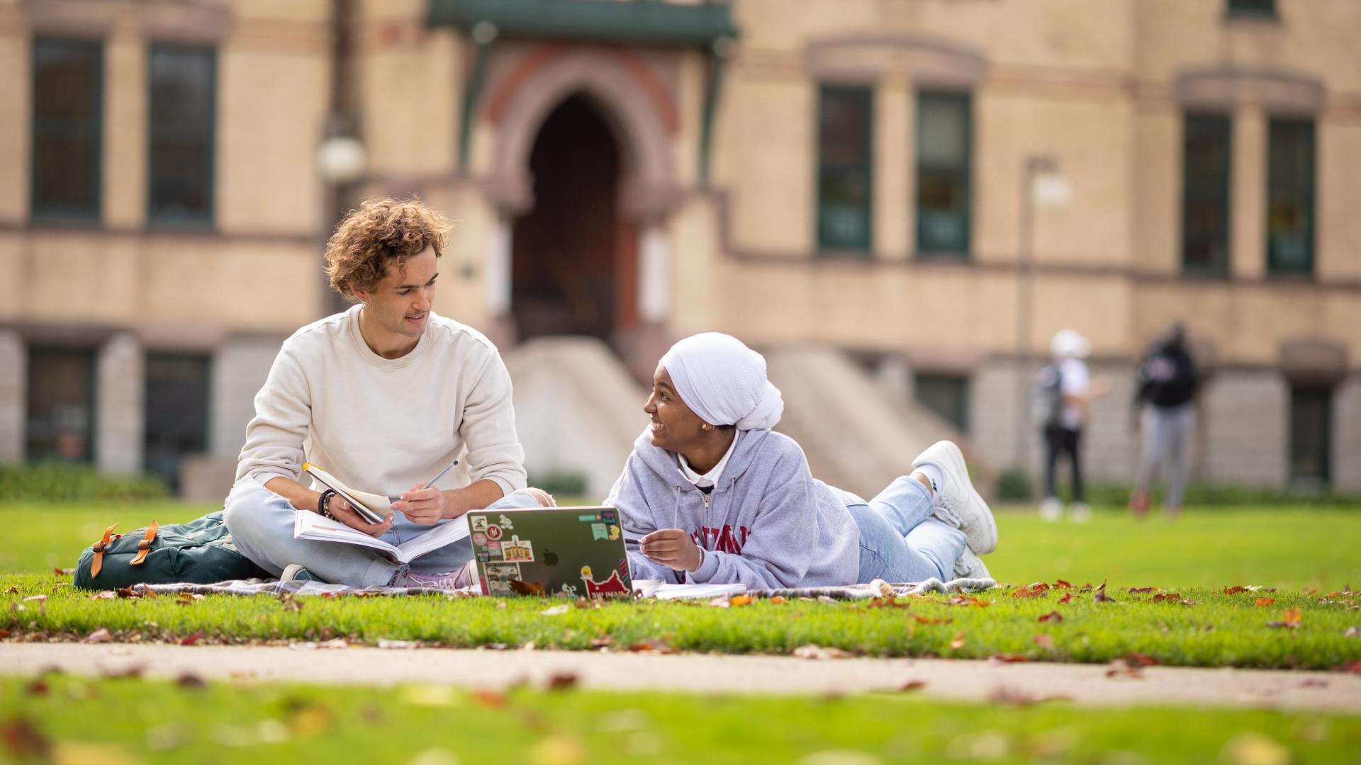 Hamline students lounging on lawn